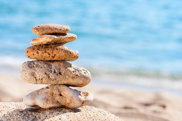 Fototapeta na wymiar Stones on sand at beach.