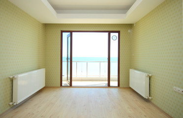 Empty small room with sea view balcony