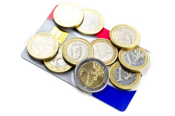 Euro coins close up on credit card