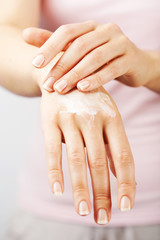 beautiful woman hands with cream