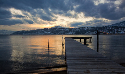 Fototapeta premium scenic dock on mountain lake at sunset