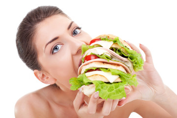 young woman eating fast food - obrazy, fototapety, plakaty