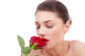 woman holding and smelling red rose