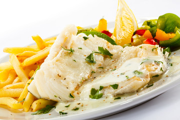Fish dish - fish fillet, French fries and vegetables