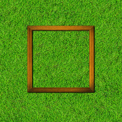 wood frame on green grass field background