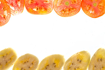 Pieces of sliced tomato and banana frame