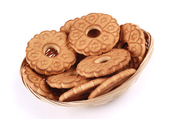 Basket with cookies on white