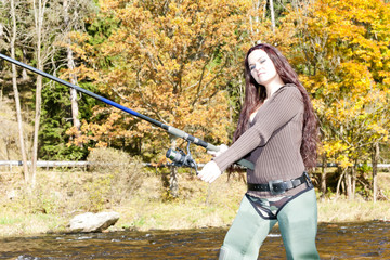 woman fishing in Otava river, Czech Republic