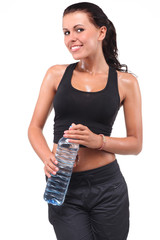 Female after gym holding a bottle of water.