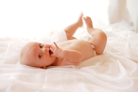 Cute Baby on a white blanket