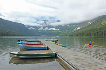 Boats on Mountain Lake with Glacier - Alberta, Canada