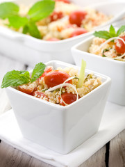vegetable couscous with cerry tomatoes and mint leaf