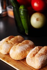 Three wheat buns in the kitchen