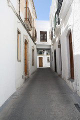 Fototapeta na wymiar Typical Whitewashed Andalusian Street
