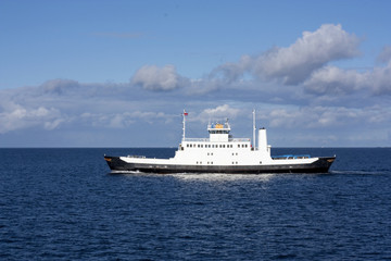 Small ferry boat on the open sea in north west Norway