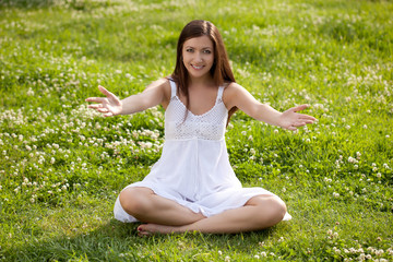 woman sitting on grass