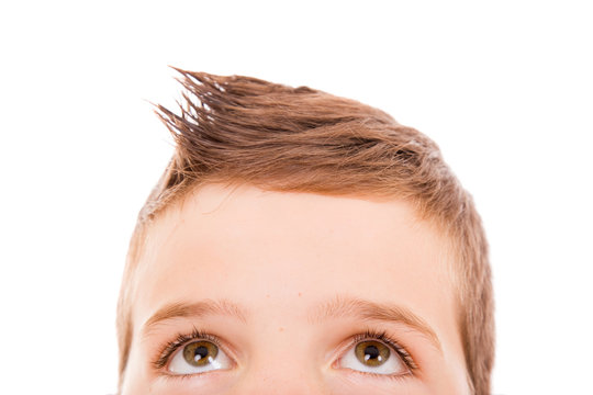 Close-up of a litle boy looking up