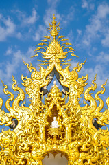 Fototapeta na wymiar Famous Gold church in Wat Rong Khun, Chiang Rai province, northe