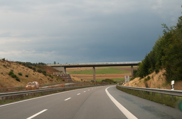 Almost deserted Autobahn under threatening skies