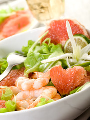 shrimp salad with slice grapefruit and lettuce