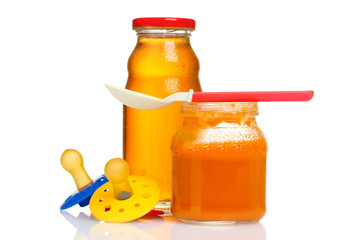 baby food and spoon isolated on white