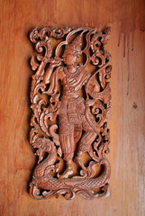 Carving man in wooden lanna style