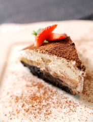 Dessert cake closeup with banana at plate