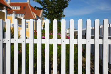White picket fence traditionally surrounding the house