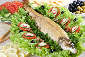Celebratory food: stuffed pike on served table