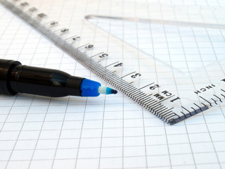 Pen, ruler and notebook