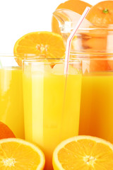 Glasses of orange juice and fruits