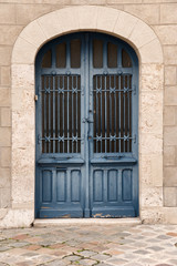 Iron door in blue color in the old part of Chartres, France