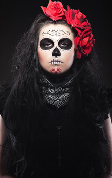 woman with roses dressed up for All Souls Day