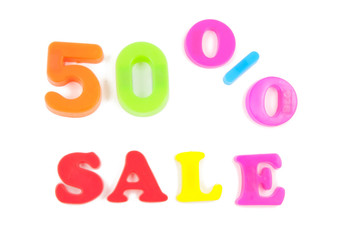 50% written in fridge magnets on white