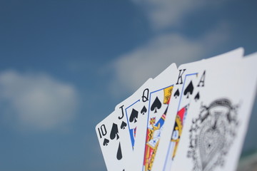Poker hand - Royal Flush, with sky background