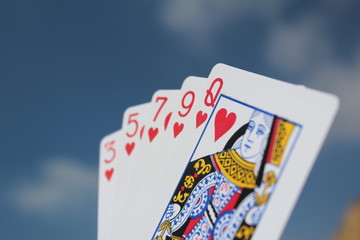 Poker hand - Flush, with sky background