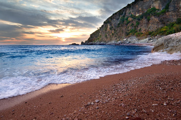 Blue sea at the sunset time