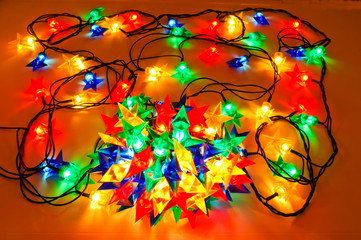 Fototapeta na wymiar Garland of colored lights for Christmas trees
