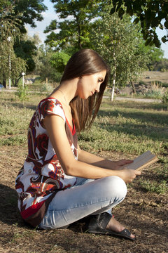 Adult girl reading a book