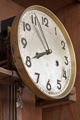 face of an antique clock indicating nearly eight