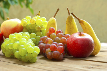 apples grapes and pears, wooden table