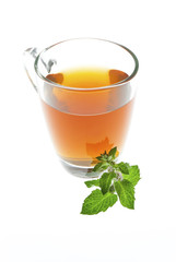tea in glass cup with mint leaf isolated on white