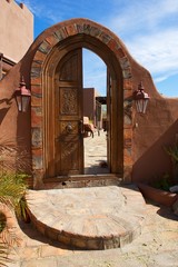 Large Arched Ornate Double Door with Brick