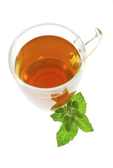 tea in glass cup with mint leaf isolated on white
