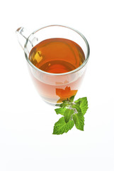 tea in glass cup with mint leaf isolated on white