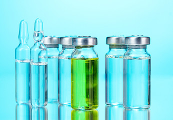 medical ampoules on blue background