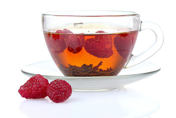black tea and raspberry in cup isolated on white