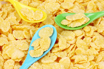 tasty cornflakes in plastic spoons
