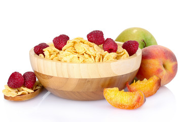 tasty cornflakes and fruit in wooden bowl isolated on white