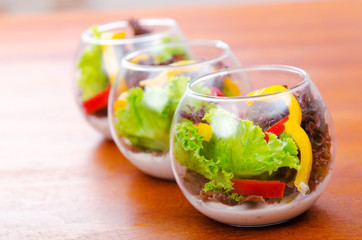 Fresh healthy salad in bowls
